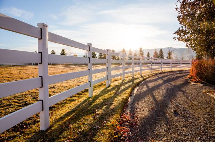 White steel fence at golden hour